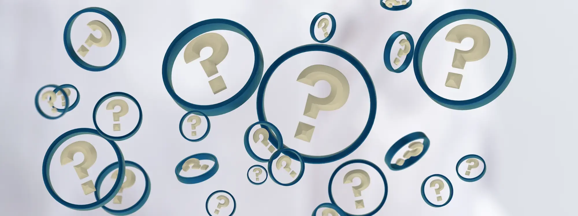 Main tenant un smartphone avec des bulles contenant des points d'interrogation flottants