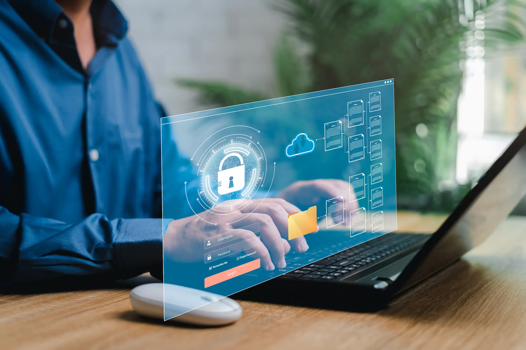 ADOBESTOCK_572925314 | Cekome Personne utilisant un ordinateur portable avec une interface holographique montrant un cadenas, des dossiers et un cloud.