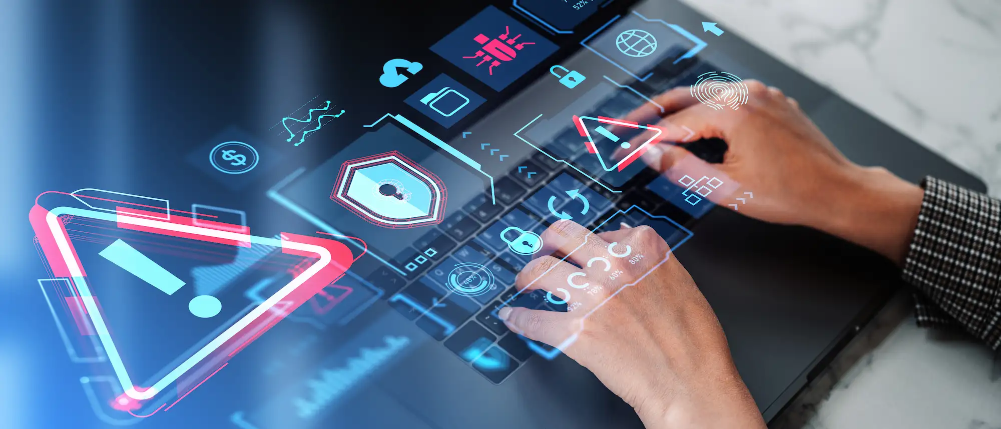 ADOBESTOCK_732765313 | Cekome Mains tapant sur un clavier d’ordinateur portable avec des icônes d’alerte et de sécurité en surimpression représentant une cyberattaque.