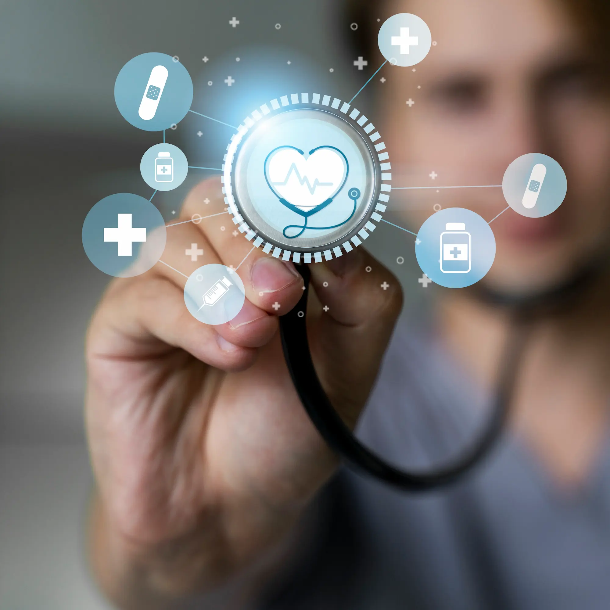 MEDICAL BANNER WITH STETHOSCOPE | Cekome Main tenant un stéthoscope avec des icônes médicales digitales symbolisant la santé connectée