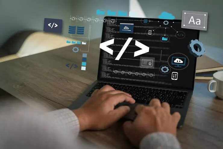 CODING WEB MAN HANDS CODING HTML DEVELOPER SOFTWARE PROGRAMMING SCREEN LAPTOP COMPUTER TYPING DATA CODE WEBSITE PROGRAMMING WITH HTML TECHNOLOGY_36325 5028 | Cekome Développeur tapant sur un ordinateur portable affichant une interface de programmation avec des icônes de code et de cloud en surimpression