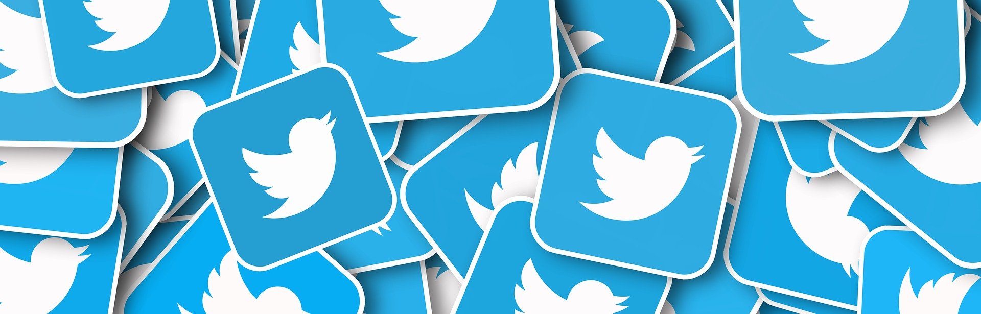 Pile d'ic&ocirc;nes Twitter bleues avec le logo blanc en forme d'oiseau